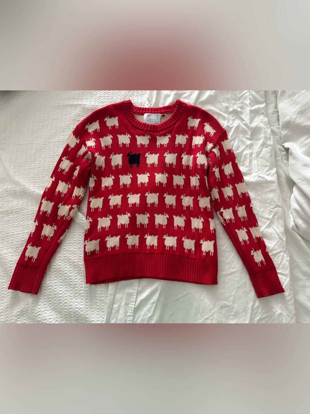 Rowing Blazers Red Crewneck Sweater with Cream Sheep Pattern and Black Accent